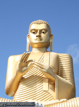 19th century golden Buddha (3o m tall) above the Golden Temple at Dambulla, near Dambulla Temple Complex in Sri Lanka. The posture is DharmaChakra Mudra (Wheel of Dharma / the Teaching Buddha).