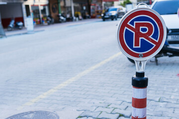 sign on the street parking is prohibited on left side there is place