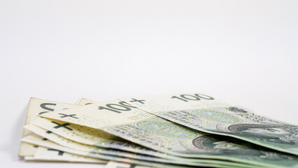 Pile of polish money on white background