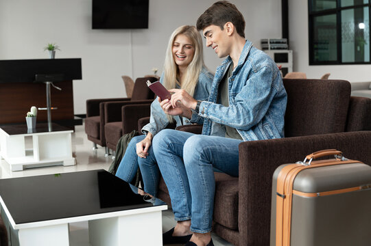 Man and woman happy with look passport at room in the airport