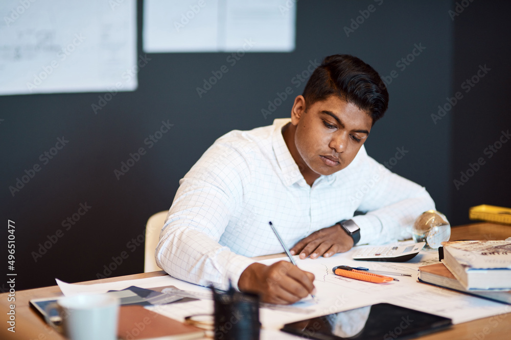 Sticker Taking his architectural business places with his technical mind. Shot of a young architect drawing up a building plan in a modern office.