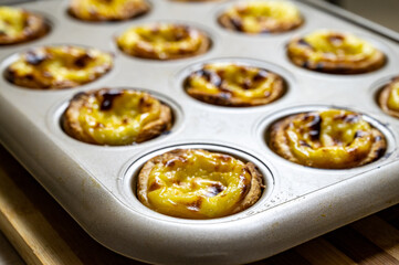 Egg tart, traditional Portuguese dessert, pastel de nata. Freshly baked.