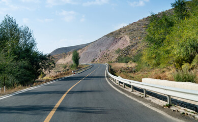 Curved asphalt road in mountains of Inner Mongolia, China