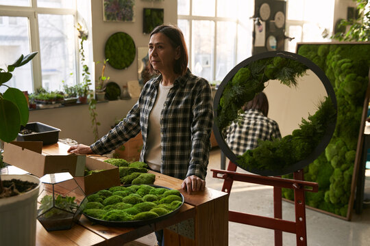 Adult woman working in the creative studio