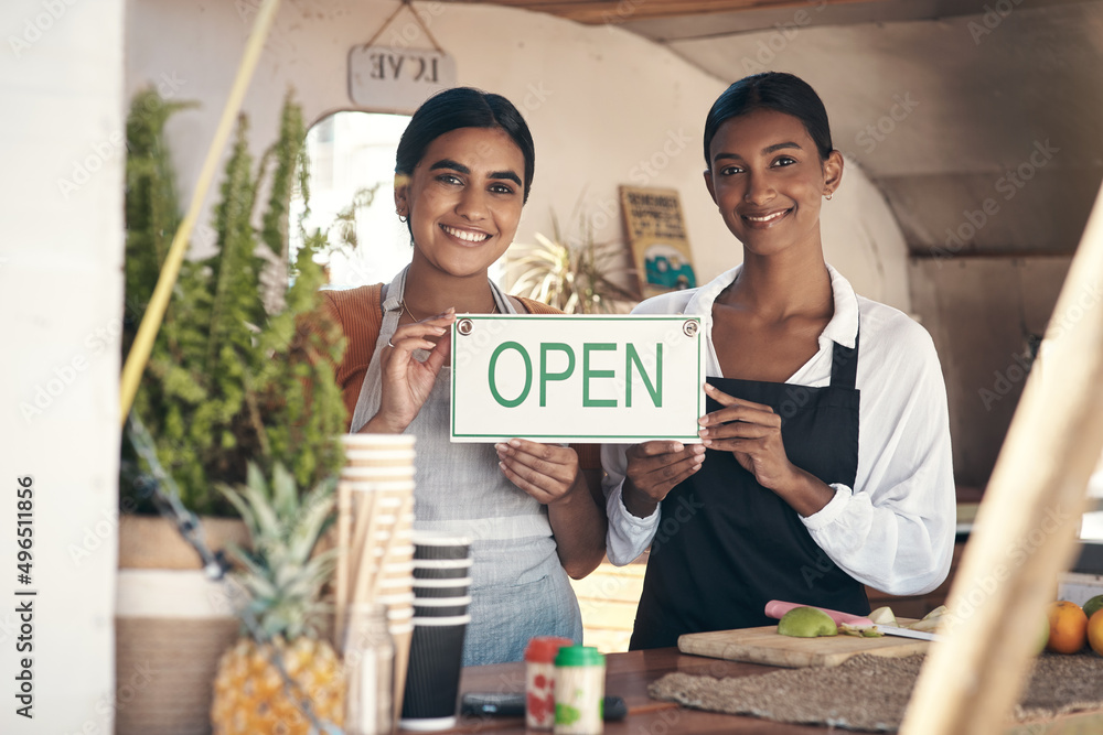 Canvas Prints Come and support new businesses. Shot of two young businesswomen holding an open sign in their food truck.