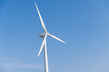 Windmill against blue sky with copyspace