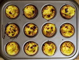 Egg tart, traditional Portuguese dessert, pastel de nata. Freshly baked.