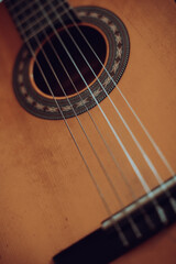 Wooden classical guitar, with plastic strings