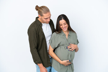 Young caucasian couple isolated on white background pregnant