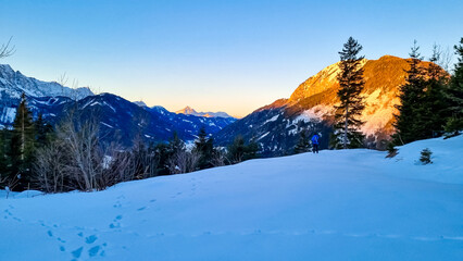 Sunrise over snow capped mountain peaks of Karawanks in Carinthia, Austria. Julian Alps. Scenic...