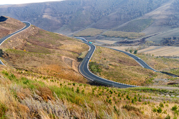 Winding road in mountain valley