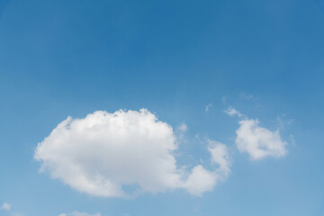 Single white cloud on blue sky