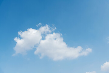 Single white cloud on blue sky