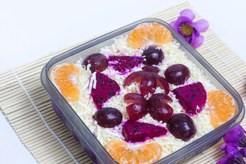 Popular and healthy fresh and delicious fruit salad. fruit salad on a white background