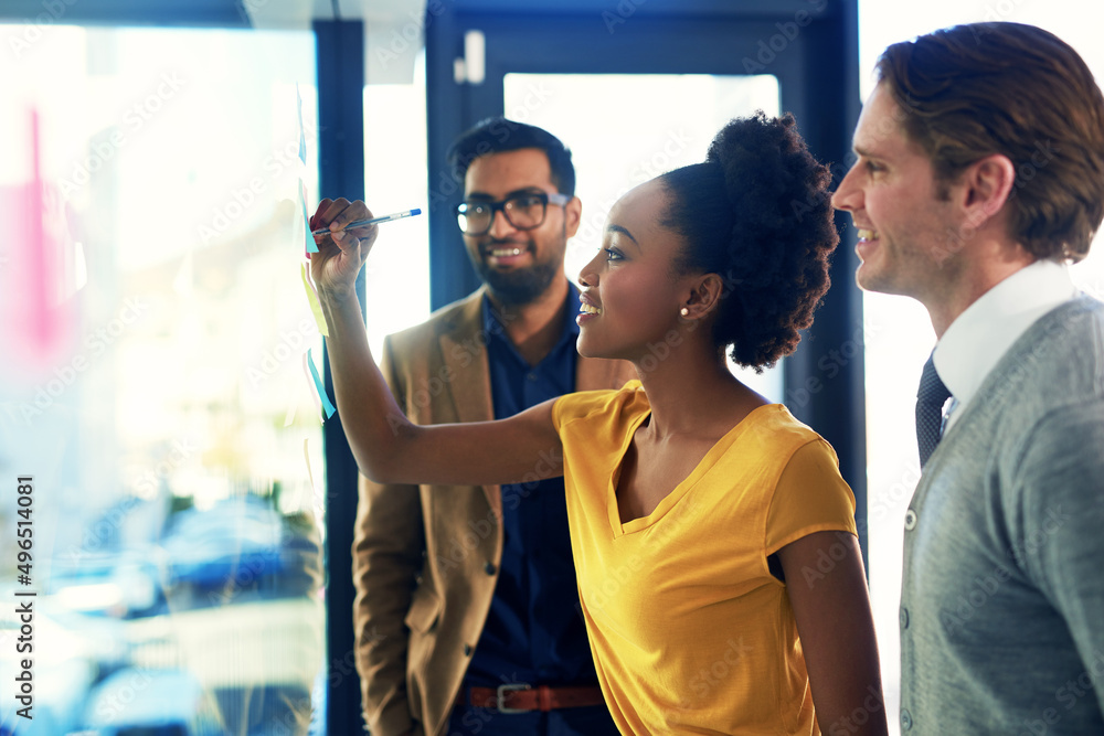 Poster Working with purpose and a plan. Cropped shot of a group of businesspeople brainstorming with notes on a glass wall in an office.