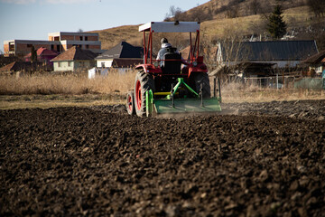 tractor working on field in springtime