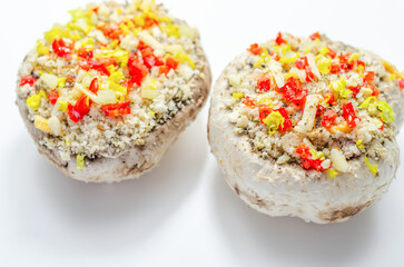 Mushrooms stuffed with onion, garlic, leek, paprika and sprinkled with cheese and breadcrumbs, snack prepared for baking