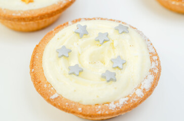All-butter pastry pies with a mincemeat filling with spiced vine fruits, topped with brandy buttercream and a sweet dusting