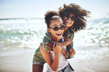 We missed the beach. Shot of two girlfriends enjoying themselves at the beach.