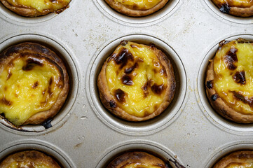 Egg tart, traditional Portuguese dessert, pastel de nata. Freshly baked.