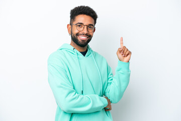 Fototapeta premium Young Brazilian man isolated on white background happy and pointing up