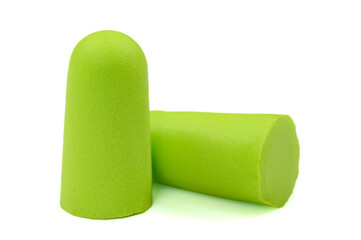 Light green ear plugs isolated on a white background.Close-up.Soft foam earplug