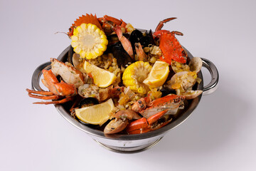 NORTH BEACH PREMIUM CLAWPINNO of fried fish, prawn, corn, shellfish and crab top view on grey background singapore food