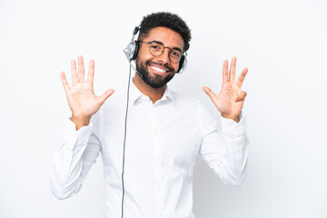 Fototapeta na wymiar Telemarketer Brazilian man working with a headset isolated on white background counting nine with fingers