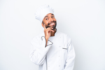 Young Brazilian chef man isolated on white background thinking an idea while looking up