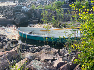 Green rowing boat by lake shore © FoxglovesAndStocking
