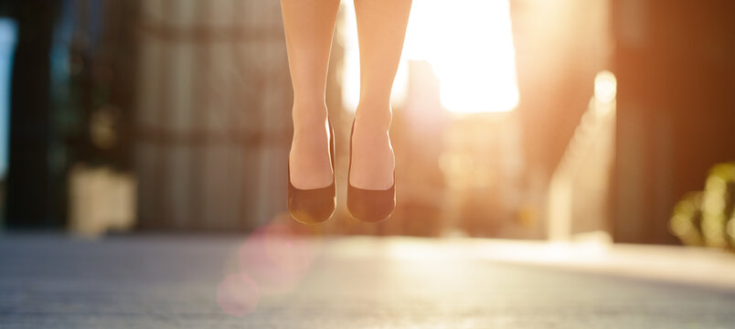 Business Woman Feet Jumping Concept Series. Shot Of A Businesswoman Jumping In The Air.