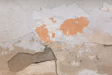 Peeling paint plaster with old weathered concrete obsolete wall cement worn texture messy background