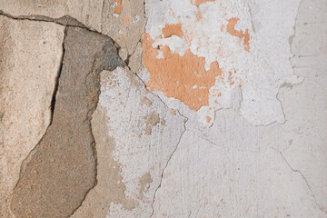 Peeling paint plaster with old weathered concrete obsolete wall cement worn texture messy background