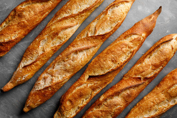 Freshly baked baguette on great background, top view