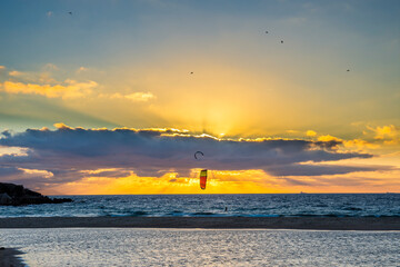 A man that practice kitesurf during in a sunset in tarifa, Spain