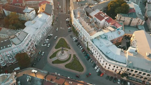 Monument named after Catherine in the city of Odessa Ukraine. Cars drive around and tourists walk around