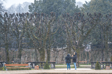 people walking in the park mirabell garden in salzburg