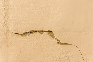 Crack on the old broken concrete retro surface of the cement wall cracked texture damaged background