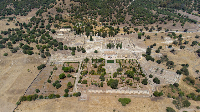 Aerial drone view of the Caliphate City of Medina Azahara in Cordoba. Archaeological site. Unesco World Heritage, Spain. Ancient civilization. Historic place. Touristic destination for holidays. 

