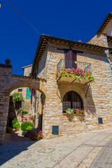 Naklejka premium Medieval street in the historic center of Spello, town in Umbria Italy