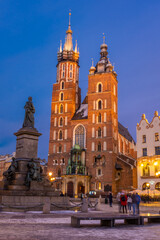 Fototapeta na wymiar The St. Mary's Basilica in Rynek Glowny square at night, Krakow, Poland