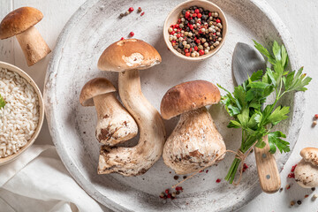 Ingredients for vegetarian risotto mushrooms with wild boletus and herbs