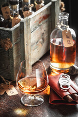 Good whisky and cigar in old distillery warehouse.