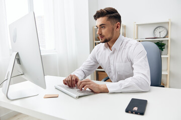 handsome businessman office worker in a white shirt executive