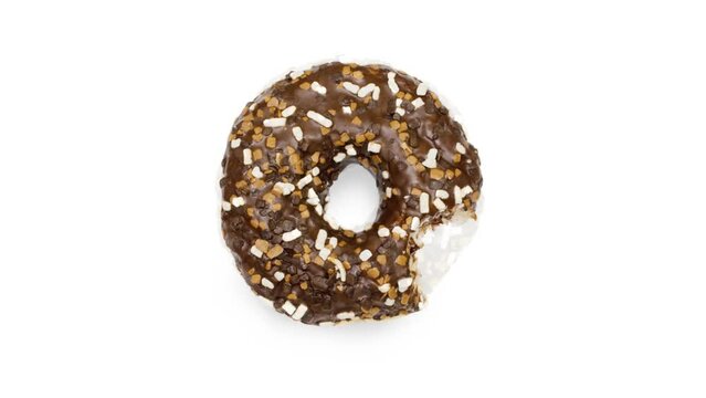 Stop motion creative concept video animation of disappearing or biting eating delicious sweet glazed icing brown doughnut donut on white background.Timelapse. Top view flat lay,unhealthy Food concept.