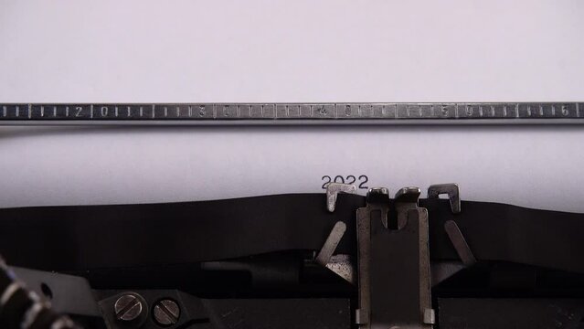 Typing phrase "2022 Russian invasion of Ukraine" on retro typewriter.