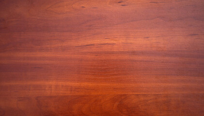 Rectangular texture made of natural mahogany. Wooden background for red wood text.