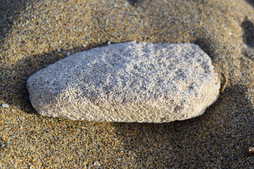 Fototapeta na wymiar pumice stone on the sand
