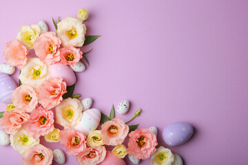 Flowers and Easter eggs on a colored background close-up. Easter background