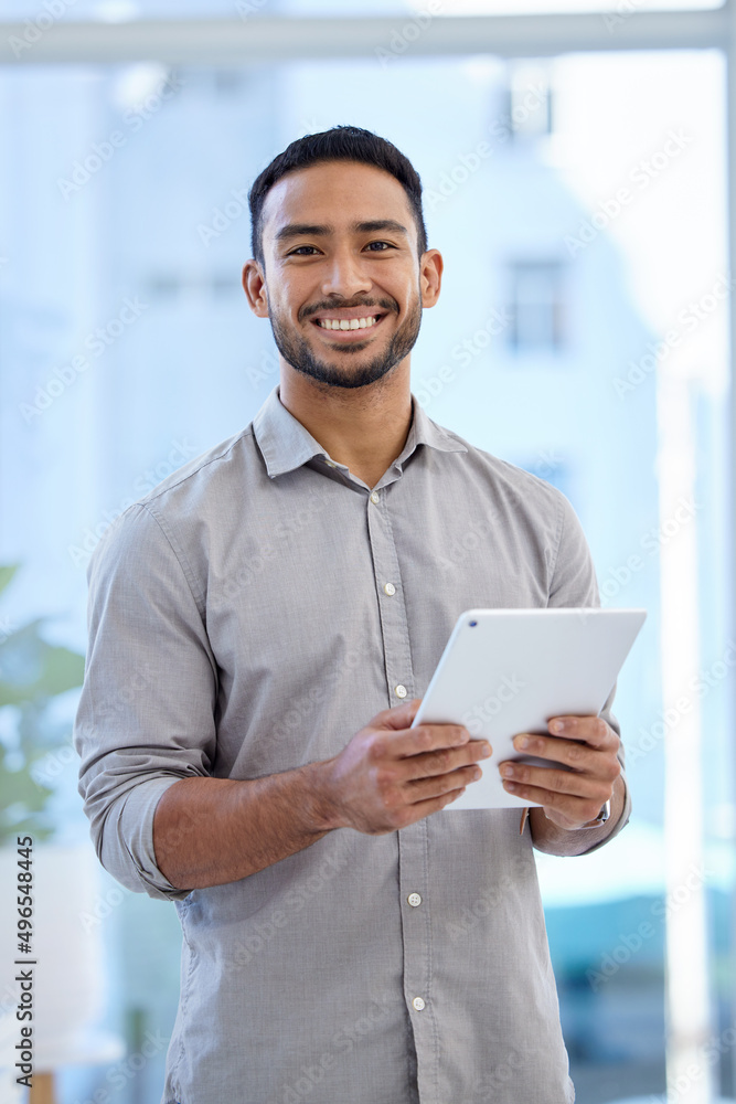 Poster theres always an app that makes my job easier. portrait of a young businessman using a digital table